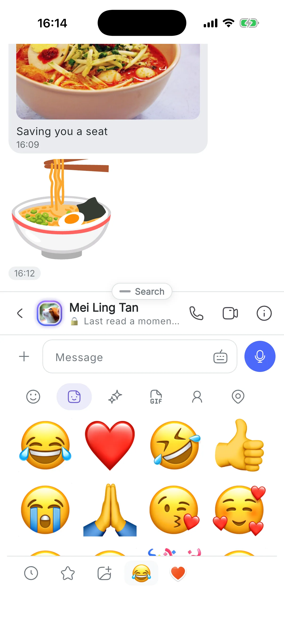 The sticker tray open in a chat, full of moving emoji